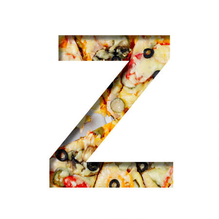 Font on pizza texture. Letter Z, cut out of paper on a background of real mediterranean pizza. Volumetric white fonts alphabet setの写真素材