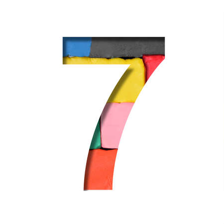 Multi-colored plasticine font. The digit seven, 7 is cut out of paper on a background with a piece of colored plasticine. Set of colored fonts.の写真素材