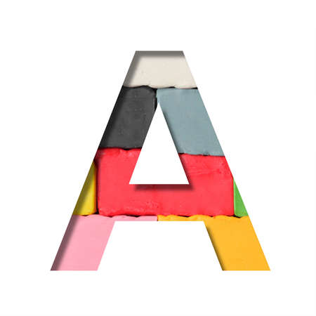 Multi-colored plasticine font. Letter A cut out of paper on a background of pieces of colored plasticine. A set of volumetric color fonts.の写真素材