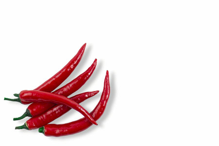 small pile of hot chili peppers on beome isolated, mockup for banner or flyer, top view, flat lay,...