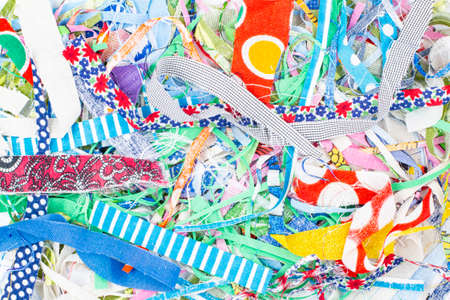 texture from pieces of different colored fabrics, trimmings for home crafts or creativityの写真素材