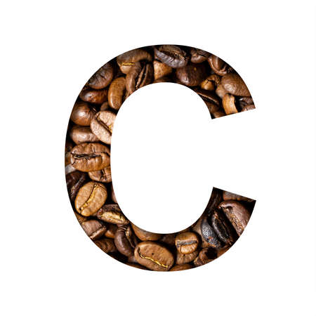 Coffee beans font. The letter C is cut out of paper on the background of roasted beans of excellent coffee. Set of decorative fonts.の写真素材