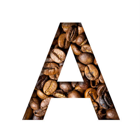 Coffee beans font. The letter A is cut out of paper on the background of roasted beans of excellent coffee. Set of decorative fonts.の写真素材
