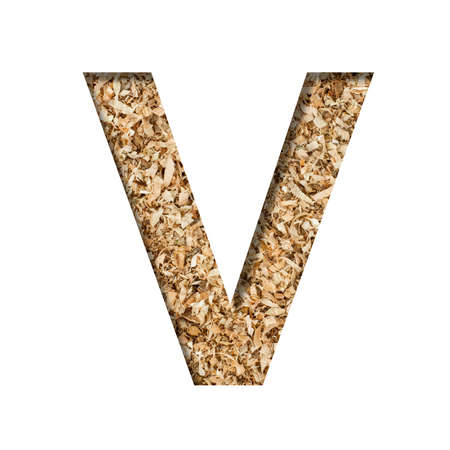 Sawdust wood font. The letter V cut out of paper on the background of sawdust or small shavings of a fruit tree. Decorative alphabet for handmade or small production, font collection.の写真素材