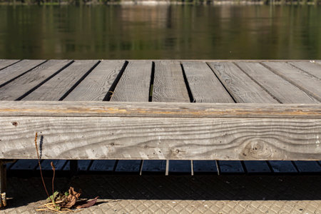 Wooden table on the river bank, close-up.の写真素材