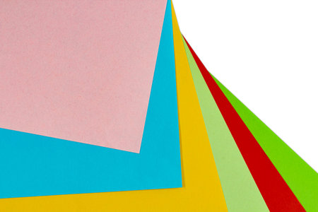 Sheets of colored paper as an abstract background, flat lay, copy space.