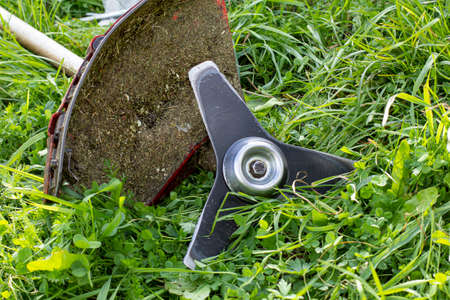 Garden grass trimmer blades and guard, close-up.の写真素材