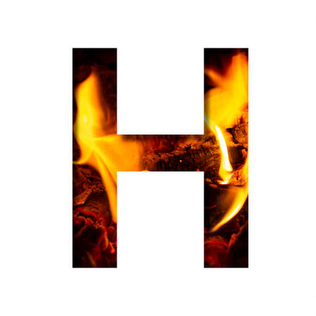 Fiery letter H from white paper on a background of fire in a fireplace or stove, decorative alphabetの写真素材