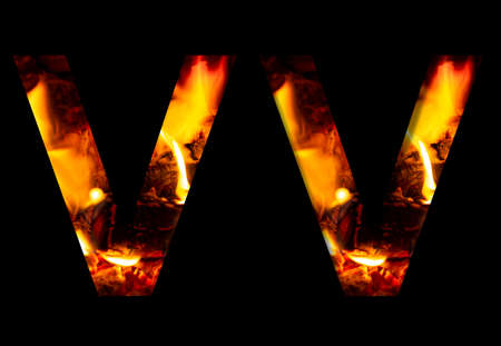 The letter V made from fire and burning wood on a black background, a double version of the alphabet for decorative signatures.の写真素材
