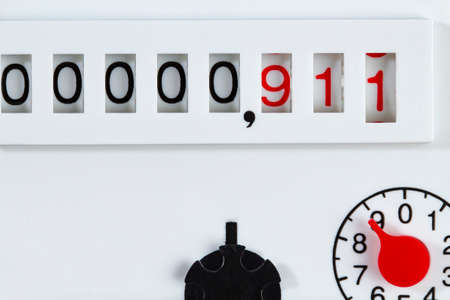 Household water or gas meter with numbers 911, the concept of saving and accounting in the household.の写真素材