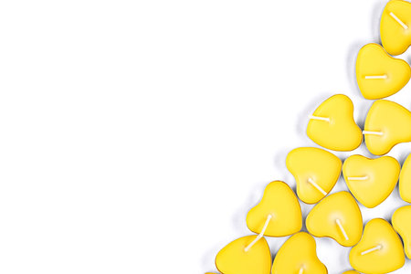 Frame of yellow scented candles on white background, top view, flat lay, copy space.