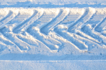 car tread footprint on snow, top viewの写真素材
