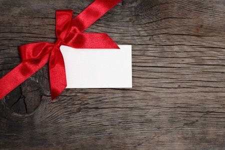 Bow with blank of card on grunge woodの写真素材