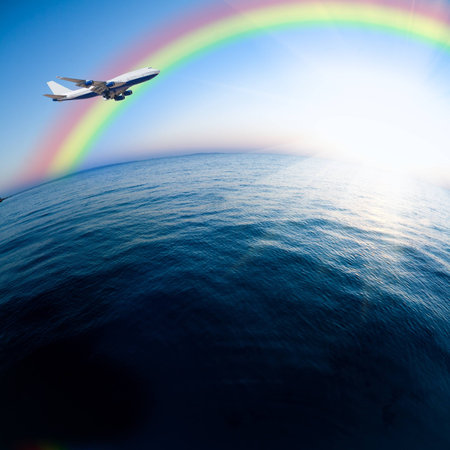 Airplane flying over the sea  Vacations conceptの写真素材