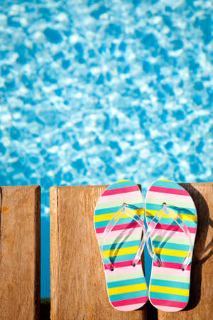 Beach s flip flops on wood  Concept image of summer holidaysの写真素材
