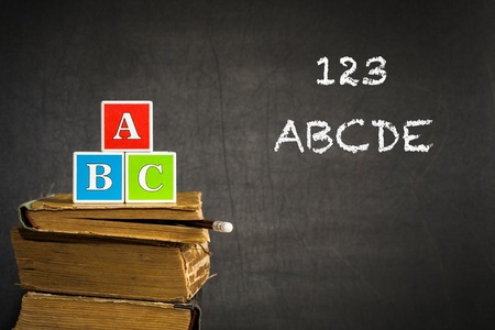 ABC on old books in class against blackboard  School conceptの写真素材