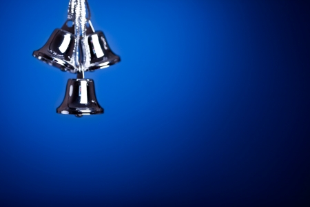 Silver Christmas tree decoration against dark blue backgroundの写真素材