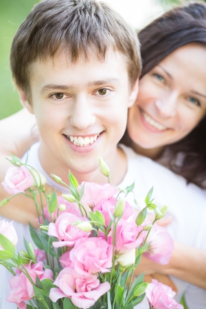 Happy couple in love with bouquet of spring flowers  Fathers day conceptの写真素材