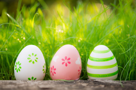 Easter eggs on green grass. Spring holidays concept