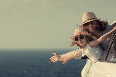 Woman and child at the beach. Summer vacations conceptの写真素材