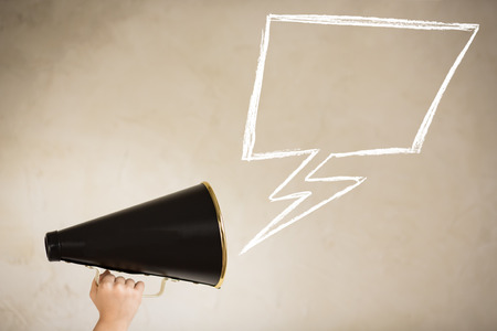 Vintage megaphone and drawing speech bubble