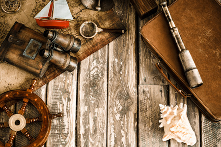 Vintage nautical things on wood background. Grunge retro toned image with copy space. Travel and adventure conceptの写真素材