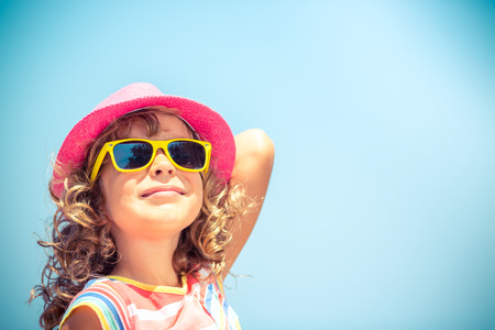 Happy child on summer vacation. Travel and adventure concept Happy child on summer vacation. Travel and adventure concept