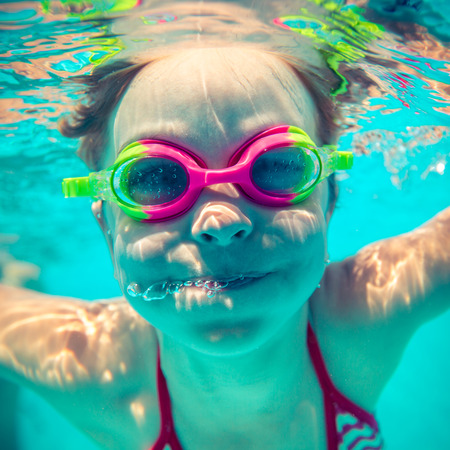 Underwater portrait of happy child. Summer vacationの写真素材