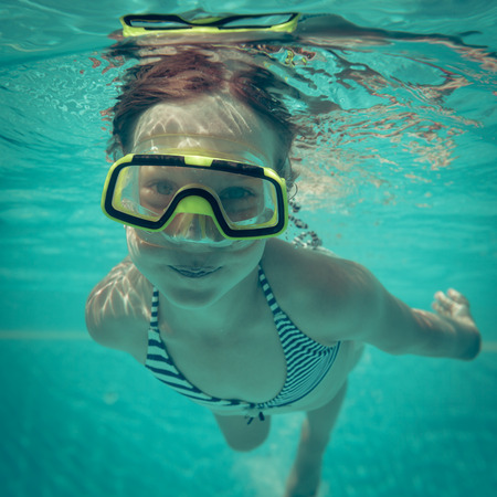 Underwater portrait of happy child. Summer vacationの写真素材