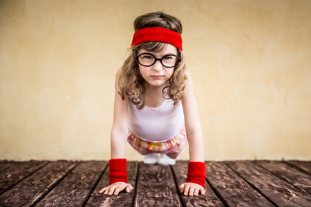 Funny strong child. Girl power and feminism concept