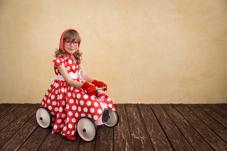Happy child playing at home. Car trip. Summer vacation and travel conceptの写真素材