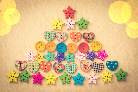 Christmas tree of buttons on vintage paper card blank. Xmas holiday conceptの写真素材
