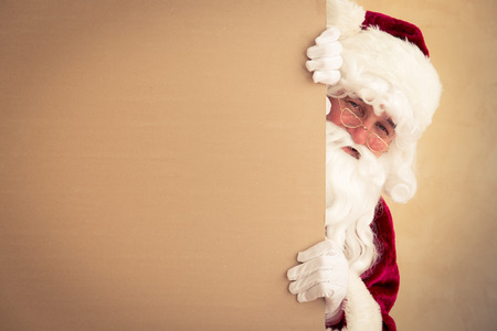 Santa Claus holding banner blank. Christmas holiday conceptの写真素材