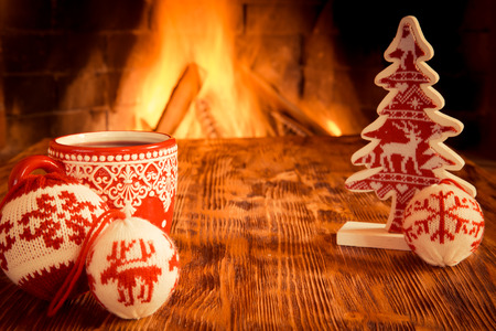 Christmas ornament near fireplace. Winter holiday conceptの写真素材