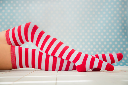 Sexy Santa woman legs. Christmas holiday conceptの写真素材