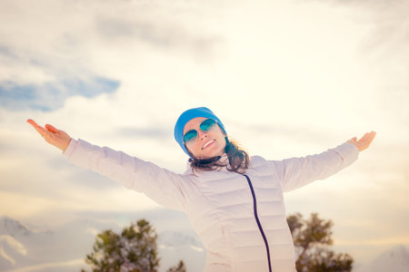 Freedom concept winter holiday vacation mountain woman