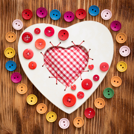 Valentine's day ornament on wood background. Winter holiday conceptの写真素材