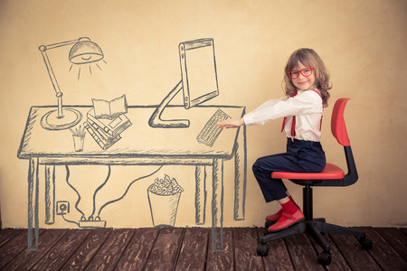 Portrait of young businessman kid in office. Success, creative and innovation conceptの写真素材