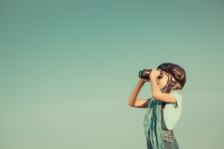 Happy kid playing outdoors. Travel and adventure conceptの写真素材