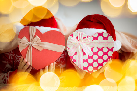 Happy couple in bedroom. Man and woman indoors. People having fun at home. Christmas Xmas Valentine Day winter holiday conceptの写真素材
