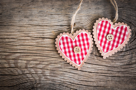 Valentines day ornament. Red hearts on wooden background. Greeting card blankの写真素材