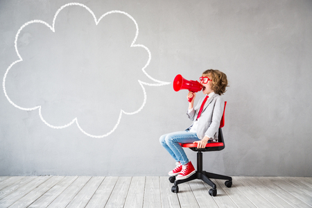 Child pretend to be businessman. Kid playing at home. Imagination, idea and start up concept. Copy spaceの写真素材