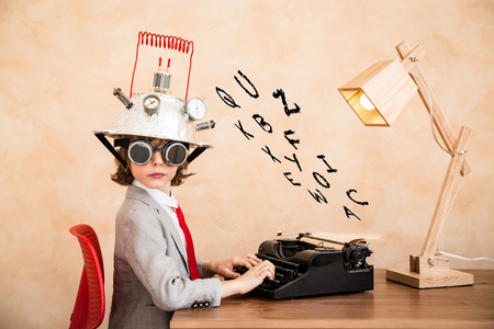 Child pretend to be businessman. Kid playing at home. Imagination, idea and creative conceptの写真素材
