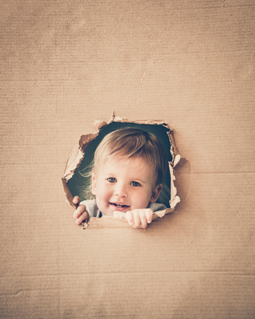 Happy child in class. Funny kid against chalkboard. Back to school. Education conceptの写真素材