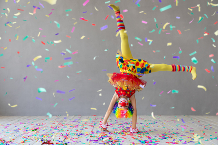 Funny kid clown. Happy child playing at home. 1 April Fool's day conceptの写真素材