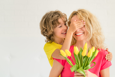 Woman and child at home. Mother and daughter having fun together. Spring family holiday concept. Mother's dayの写真素材