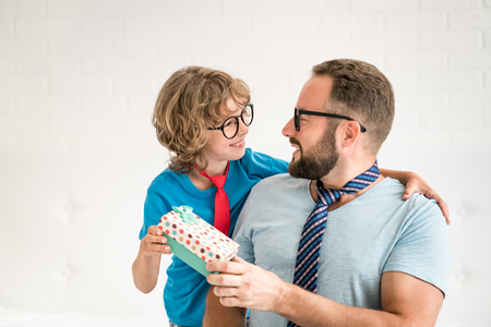 Man and child at home. Father and kid having fun together. Family holiday concept. Happy Father's dayの写真素材