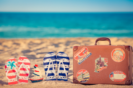 Beach flip-flops on the sand. Summer vacation conceptの写真素材