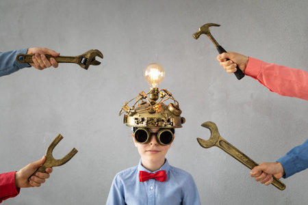 Portrait of child in classroom. Kid with toy virtual reality headset in class. Education, idea and...
