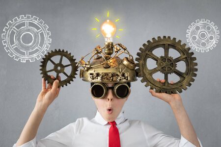 Smart child pretend to be businessmen. Funny kid playing at home. Education, start up and business idea conceptの写真素材